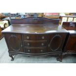 A Chippendale Revival carved mahogany serpentine sideboard