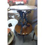 A pair of circular cast aluminium pub tables