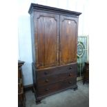 A George III mahogany linen press (lacking interior slides)