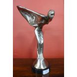 A chrome Spirit of Ecstasy, on black marble socle