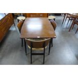 A tola wood extending dining table and four chairs