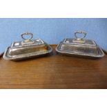 A pair of silver plated entrée dishes and covers