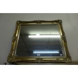 A gilt framed mirror