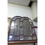 A pair of Cathedral style mahogany framed mirrors