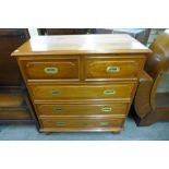 A campaign style mahogany chest of drawers