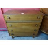 A teak chest of drawers