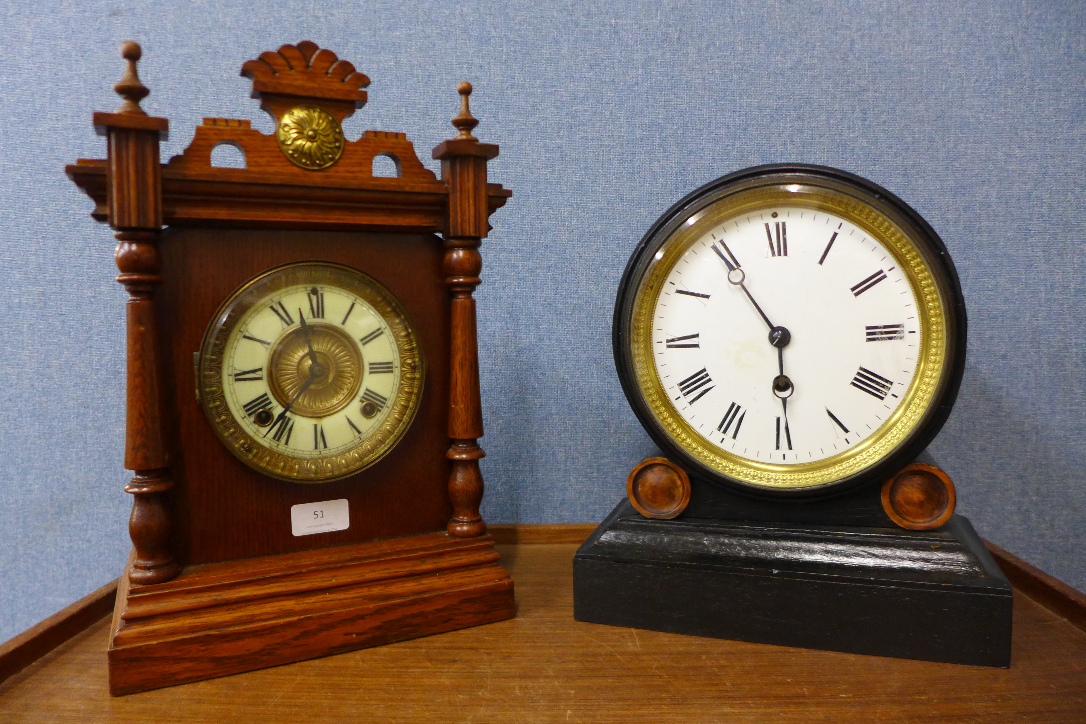 A 19th Century American oak shelf clock and an ebonised mantel clock