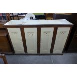 A Victorian painted oak four door locker/cupboard