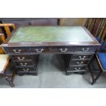 A mahogany pedestal desk