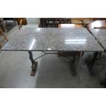 A cast iron and granite pub table