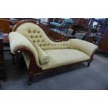 A carved walnut and upholstered chaise longue