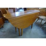 A teak drop-leaf table