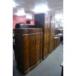 An Art Deco figured walnut four piece bedroom suite