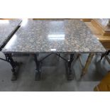 A cast iron and granite pub table