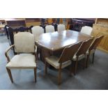 An Art Deco walnut dining table and eight chairs