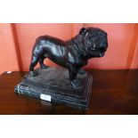 A bronze figure of a dog, on black marble plinth