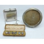 A cased set of six shirt studs, circular mirror and purse