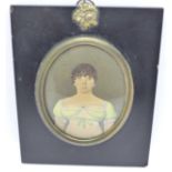 A Regency miniature watercolour portrait of a lady in an ebonised frame