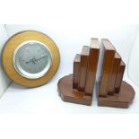 A pair of bookends and an aneroid barometer