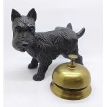A brass desk bell and a cast metal figure of a Scottie dog