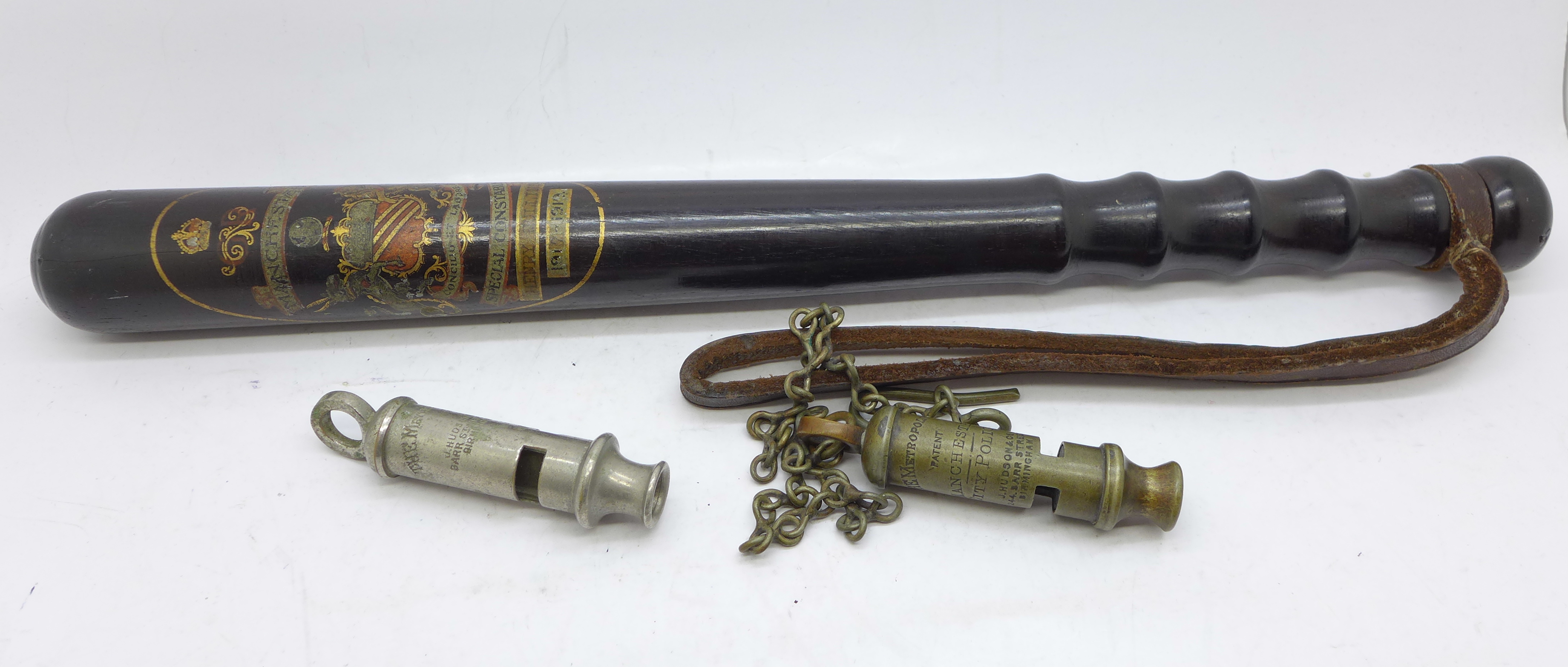 A Manchester Special Constabulary police truncheon and two whistles