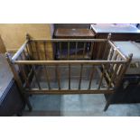 An early 20th Century oak cot