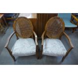 A pair of Art Deco walnut bergere fireside armchairs