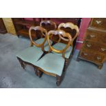 A set of four Victorian mahogany balloon back dining chairs