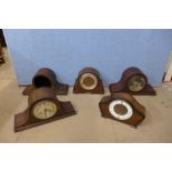 Four oak mantel clocks and a walnut mantel clock