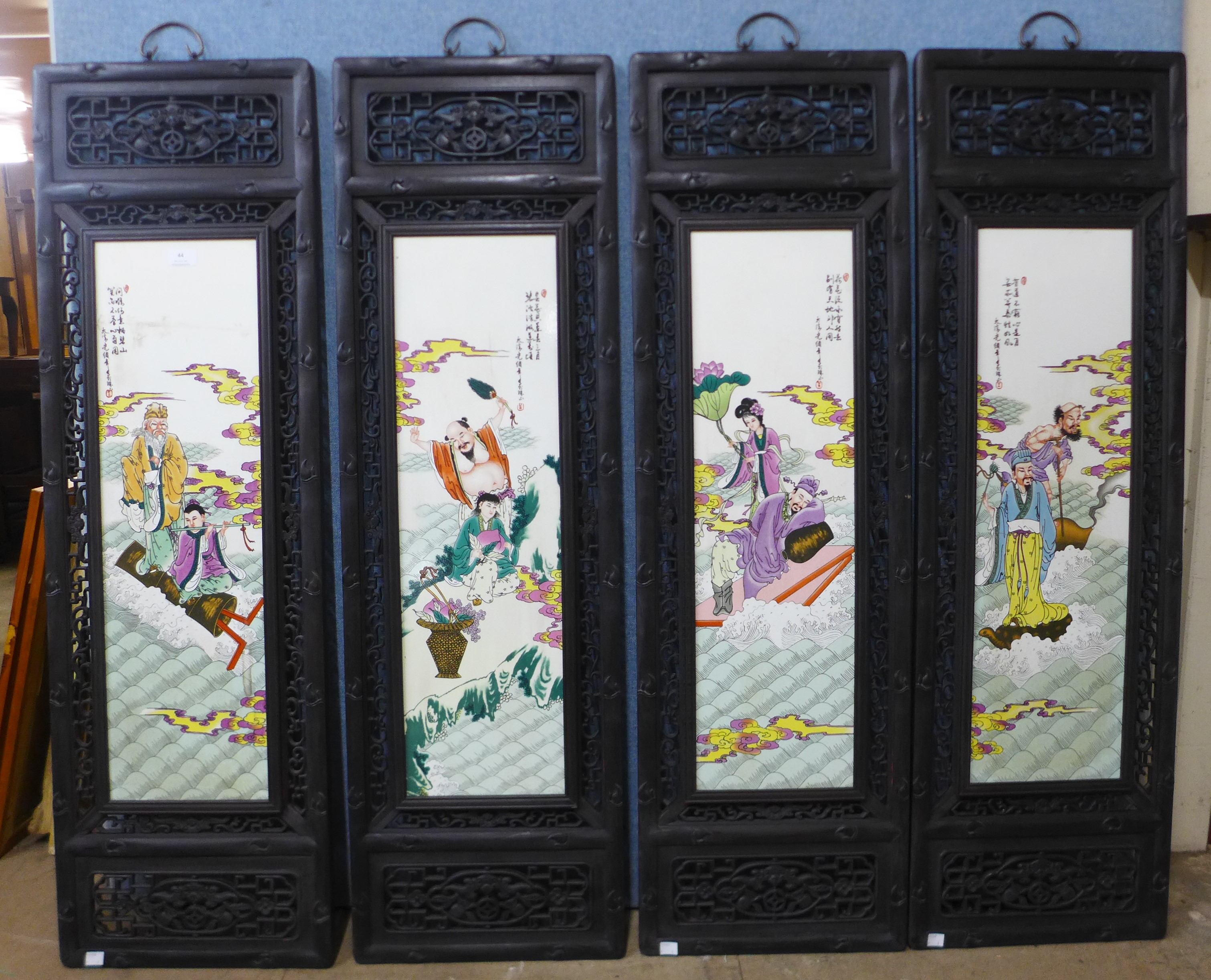 A set of four Chinese porcelain tiles, framed