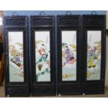 A set of four Chinese porcelain tiles, framed