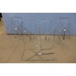 A set of eight chrome haberdashery shop stands