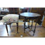 A Victorian mahogany and needlework stool and a small table