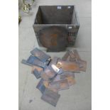 Assorted copper printing plates and an advertising crate