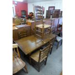 An oak refectory table and five chairs