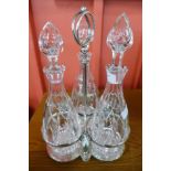 A silver plated decanter stand with three cut glass decanters