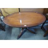 A Bevan & Funnell mahogany oval rise and fall coffee table