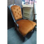 A Victorian mahogany and upholstered nursing chair