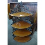 A Victorian cast iron and mahogany five tier corner whatnot