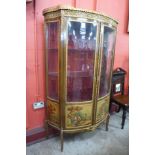 A French Louis XV style beech and gilt metal mounted Vernis Martin vitrine, with painted panels