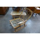 An Ercol blonde rocking chair