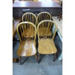 A set of four Victorian elm and beech kitchen chairs