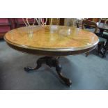 A Victorian walnut circular tilt-top breakfast table