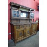 An Arts and Crafts oak mirrorback buffet sideboard