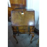 A small Queen Anne style walnut bureau de dame