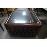 A brown leather and glass topped coffee table