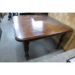 A Victorian mahogany dining table