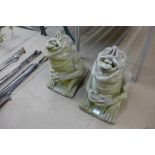 A pair of concrete gargoyles