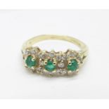 A 9ct gold, emerald and diamond triple cluster, hallmark worn, 2.2g, K