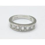 An 18ct white gold ring set with baguette and princess cut diamonds, 0.5carat diamond weight